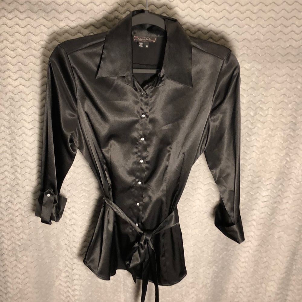 Shiny black button down shirt.